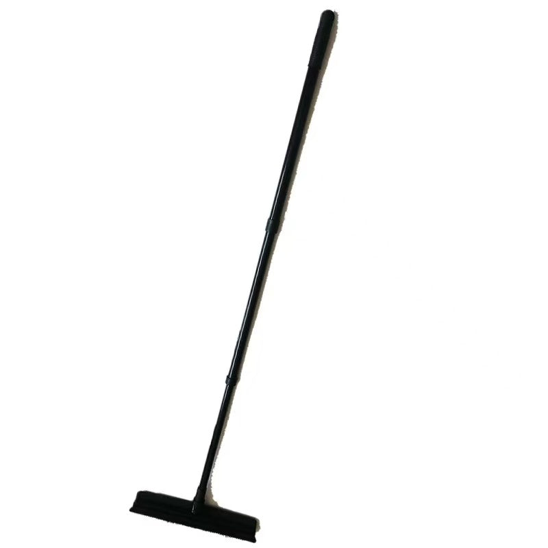 A broom for cleaning cat hair on the carpet black